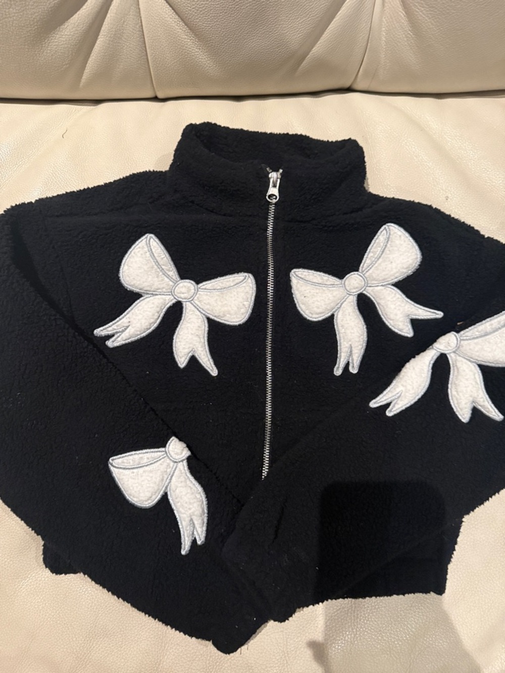 Kids Black Zip-Up Puffer Jacket with White Bow Appliqués